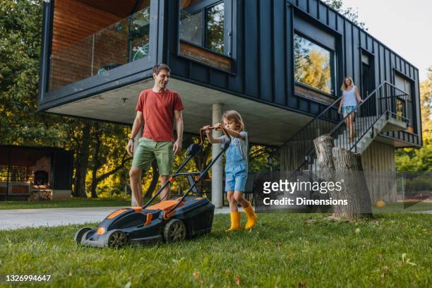 who said mowing the lawn couldn't be fun? - lawn mowing stock pictures, royalty-free photos & images