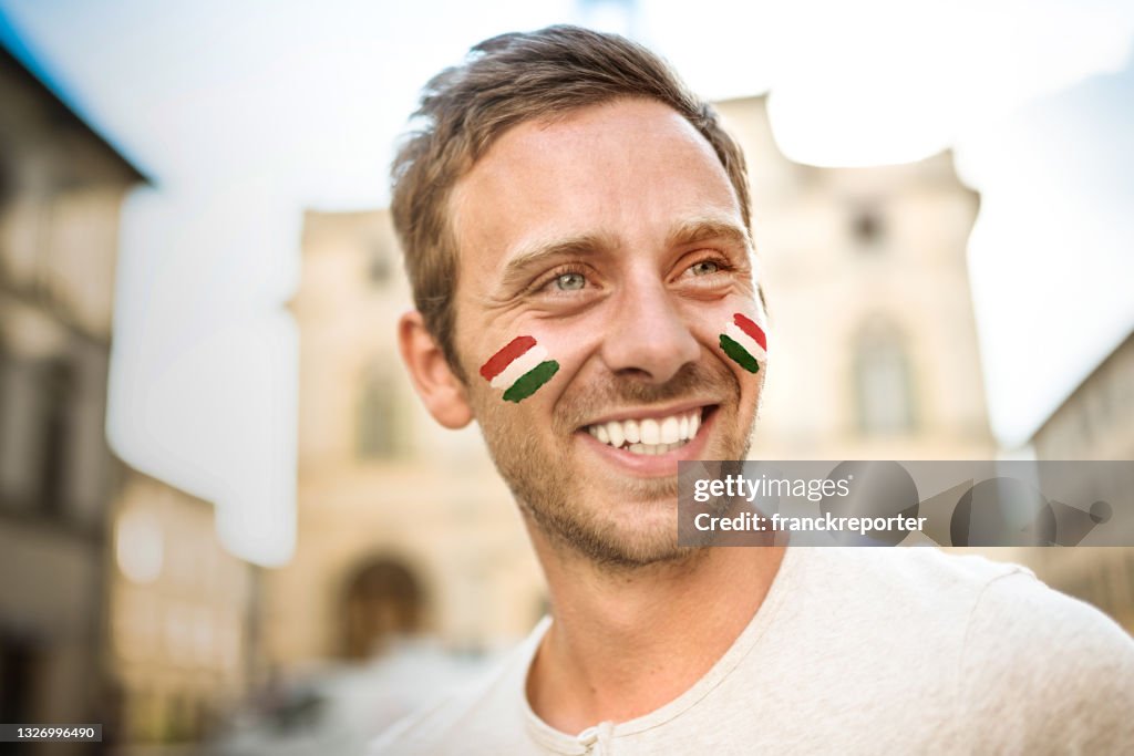 Happiness italian supporter smiling on the street