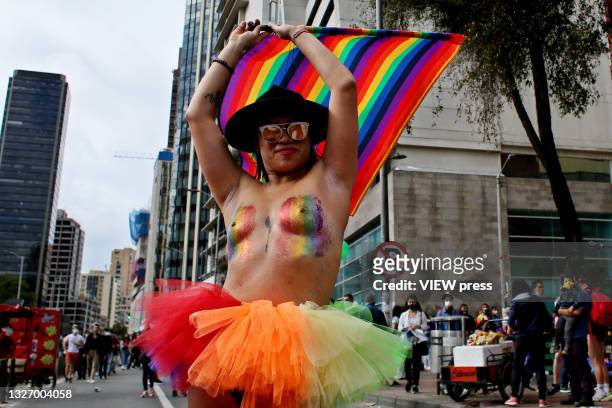 Reveler performs during a LGBTIQ+ pride parade on July 04, 2021 in Bogota, Colombia. The parade is a protest against violence suffered by the LGBTIQ+...