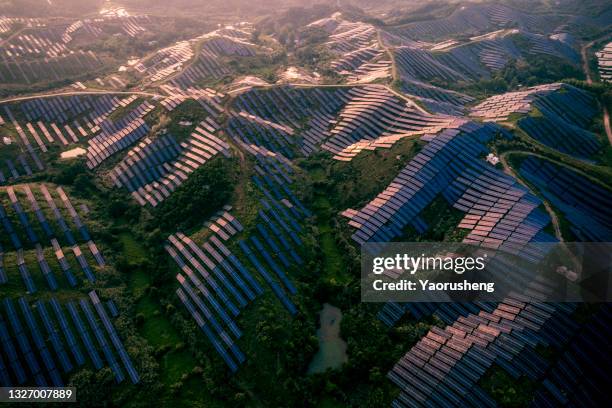 aerial view of  big scale of solar energy plant on the mountains area - anhui pastoral stock pictures, royalty-free photos & images