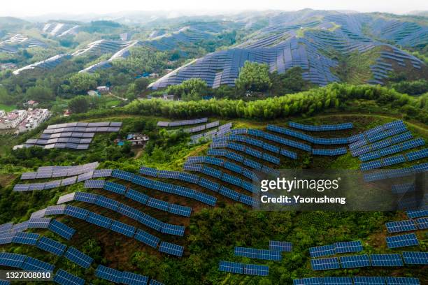 aerial view of  big scale of solar energy plant at the mountains area - summit station stock pictures, royalty-free photos & images