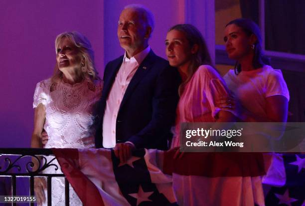 President Joe Biden, first lady Jill Biden and granddaughters Finnegan Biden and Naomi Biden watch the fireworks display during a Fourth of July BBQ...