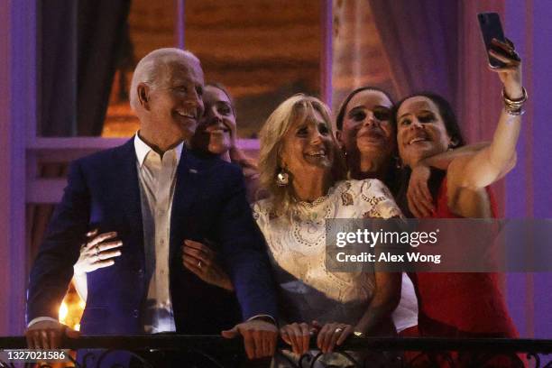 President Joe Biden, granddaughter Finnegan Biden, first lady Jill Biden, granddaughter Naomi Biden and daughter Ashley Biden pose for a selfie as...