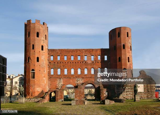Italy, Piemonte, Turin, Porta Palatina. Whole artwork view. Front view Roman gate polygonal towers gateways two orders of windows in foreground copy...