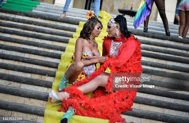 Members of the LGBT community make a presentation on the steps of the departmental library of Valle del Cauca during a LGBTIQ+ Pride parade on July...