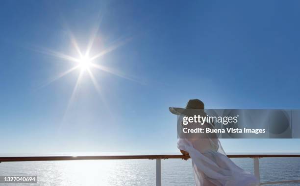 woman ao a cruise ship watching sea and sky - cruise deck stock pictures, royalty-free photos & images