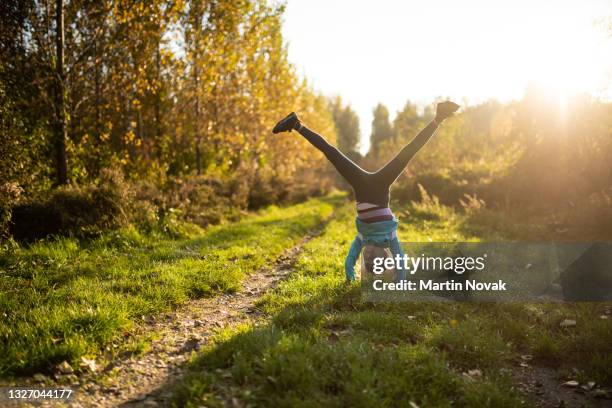 handstand - fun in autumn nature - ring toss bildbanksfoton och bilder