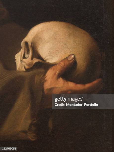 Italy, Lazio, Rome, Santa Maria della Concezione Church. Whole artwork view. Skull, Vanitas, hand sleeve habit half light semi darkness dim light.,...