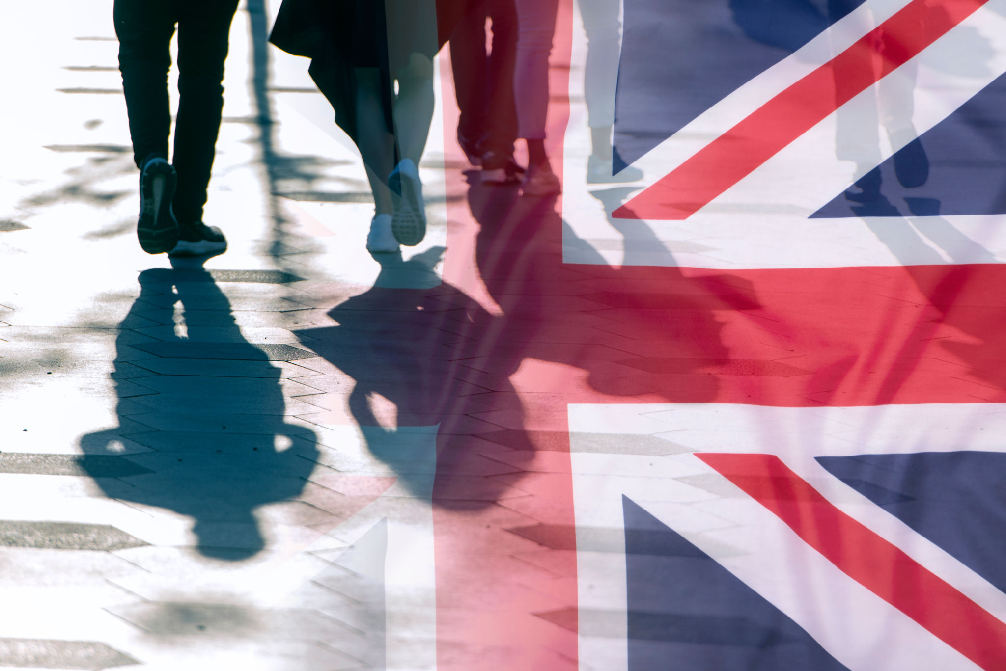 Shadows of People and UK Flag Citizens of Great Britain Shadows of People and UK Flag Citizens of Great Britain