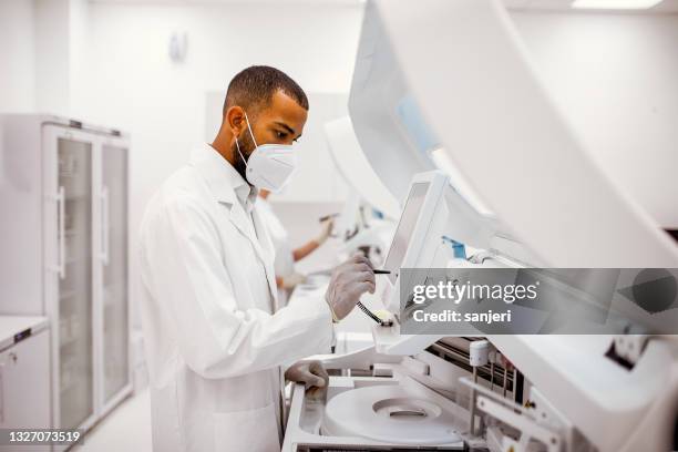 scientist working in the laboratory - science equipment stock pictures, royalty-free photos & images