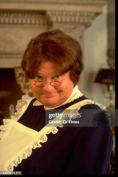 Comedian Benny Hill dressed as a maid, circa 1983.