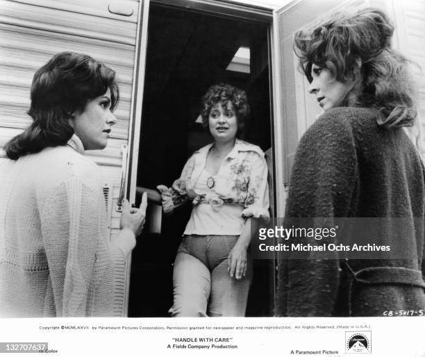Marcia Rodd and Ann Wedgeworth share a look of surprise when Alix Elias answers the doorbell in a scene from the film 'Handle With Care', 1977.