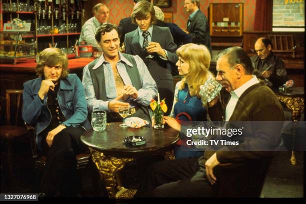 Actors Peter Cleall, George Baker, Malcolm McFee, Carol Hawkins and Alister Williamson in character on the set of sitcom The Fenn Street Gang, circa...