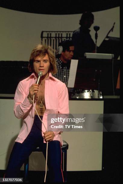 Comedian Freddie Starr performing on stage, circa 1974.