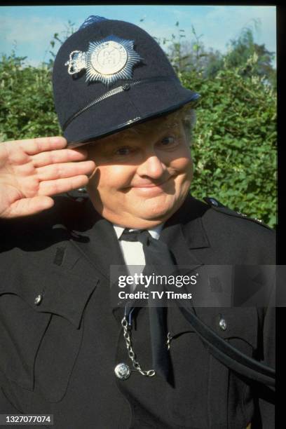 Comedian Benny Hill dressed as a police officer, circa 1989.