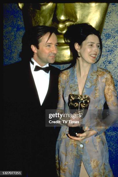 Actors Neil Pearson and Gina McKee photographed at the BAFTA Film and Television Awards at the Royal Albert Hall in London on April 29, 1997.