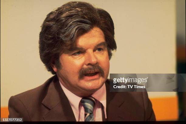 Comedian Benny Hill dressed as sports presenter Dickie Davies, circa 1979.