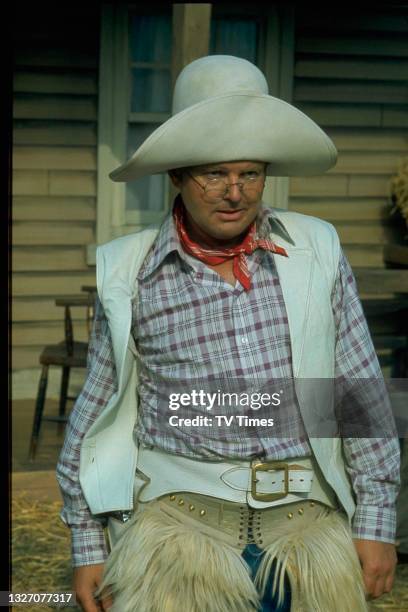Comedian Benny Hill dressed as a cowboy, circa 1975.