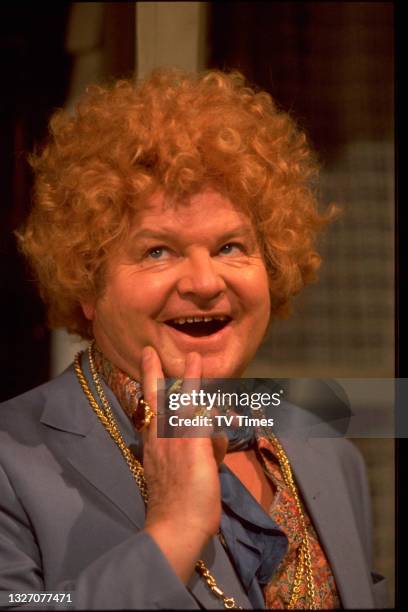 Comedian Benny Hill performing in a sketch, circa 1983.