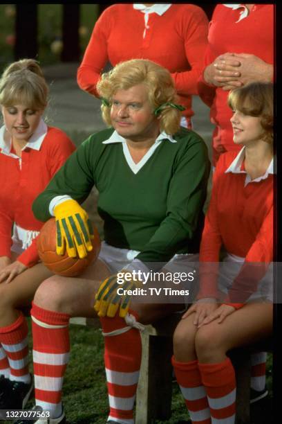 Comedian Benny Hill dressed as a female footballer, circa 1980.