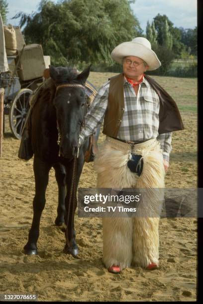 Comedian Benny Hill dressed as a cowboy, circa 1989.