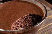 A transparent bowl with chocolate mousse