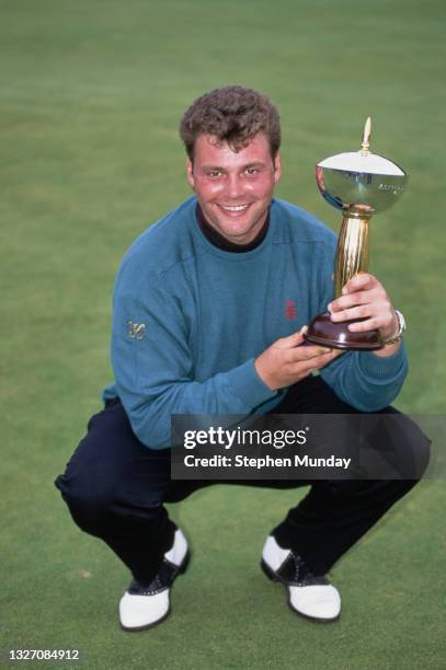 Darren Clarke of Northern Ireland holds the Champion golfer trophy after winning the 1993 Alfred Dunhill Belgian Open golf tournament on 10th October...