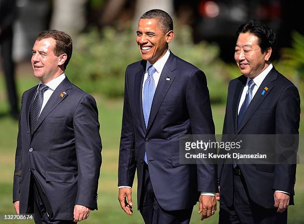 Russian President Dmitry Medvedev U.S. President Barack Obama and Prime Minister of Japan Yoshihiko Noda, walk out to the family photo setup at the...