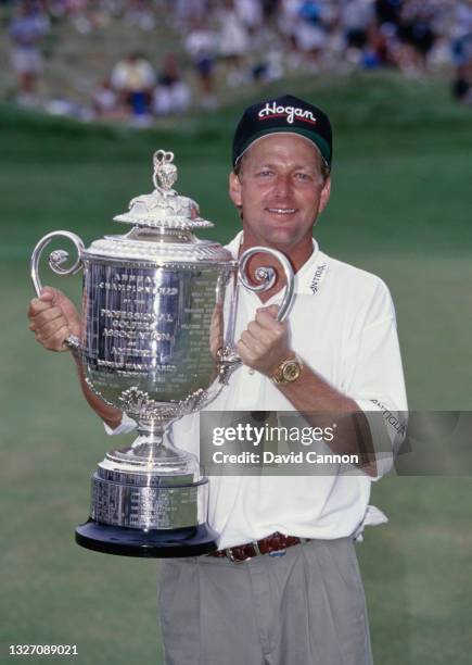 Mark Brooks of the United States holds the champion golfer trophy after winning the 78th US PGA Championship golf tournament on 11th August 1996 at...