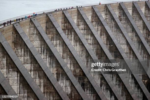 Tadej Pogačar of Slovenia and UAE-Team Emirates yellow leader jersey & The peloton passing through Col du Pré during the 108th Tour de France 2021,...