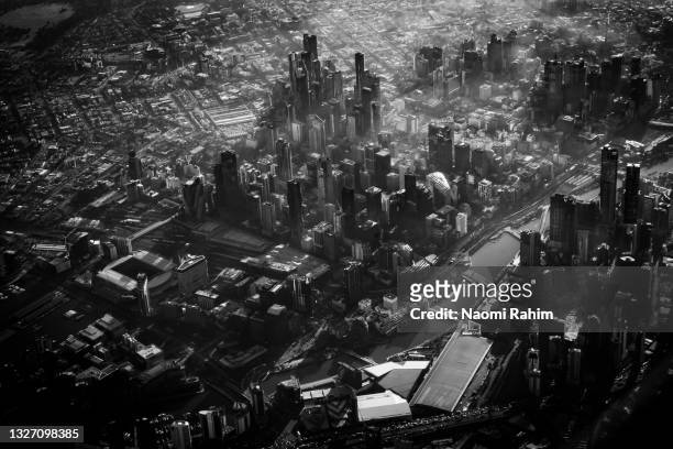 close up aerial view of foggy melbourne city - docklands stadium melbourne stock pictures, royalty-free photos & images