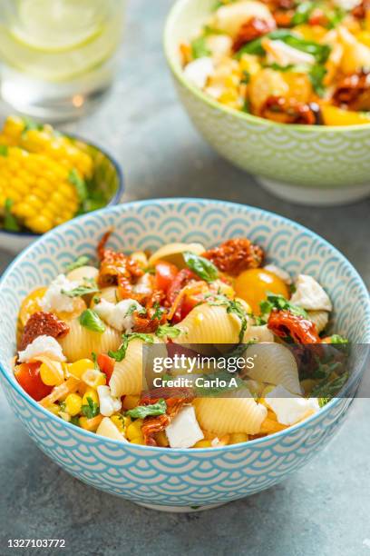 summer pasta salad in  a bowl - pasta salad stock pictures, royalty-free photos & images