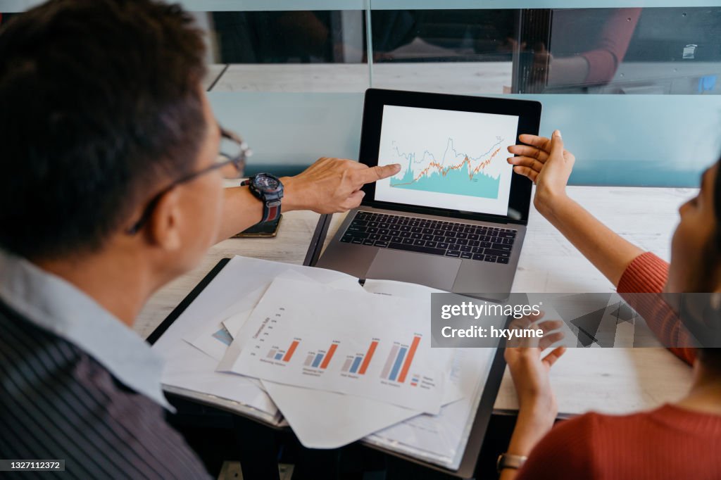 Asian business professionals working in office