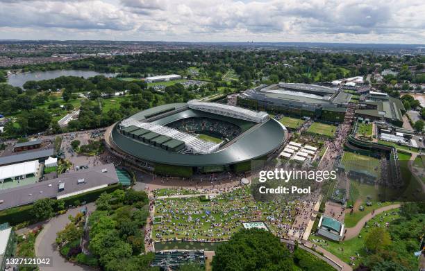 Aerial view across the grounds as spectators watch the big screen on the outside of No.1 Court during Day Seven of The Championships - Wimbledon 2021...