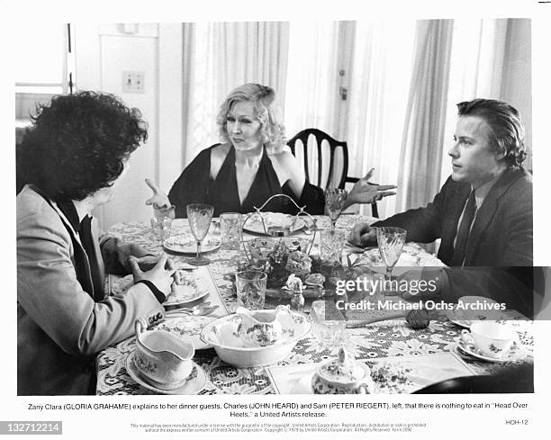 Gloria Grahame explains to her guests Peter Riegert and John Heard that there is nothing to eat in a scene from the film 'Head Over Heels', 1979.