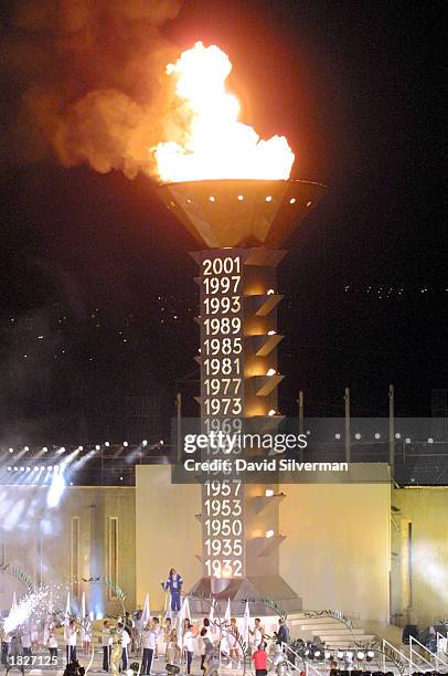 The 16th Maccabi Games flame is lit by Israeli handicapped sportswoman Karen Lebowitz during the games'' opening ceremony July 16, 2001 in Jerusalem....