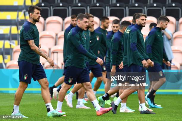 Andrea Belotti of Italy and teammates look on during the Italy Training Session ahead of the Euro 2020 Semi-Final match between Italy and Spain at...