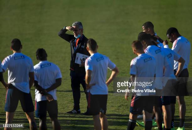 Reinaldo Rueda, head coach of Colombia speaks with his players during a training session at Estadio Ciro Machado ahead of the semi-final match...