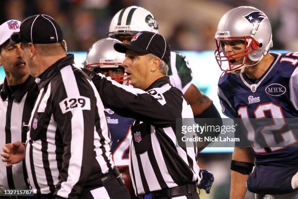 Tom Brady of the New England Patriots argues with the umpire Bill Schuster side judge Tom Hill after a call during the game against the New York Jets...