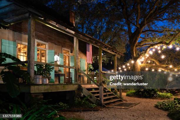 louisiana french creole cottage at night - louisiana home stock pictures, royalty-free photos & images