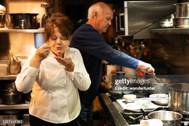 tasting gumbo in a cooking class - hot wife stockfoto's en -beelden