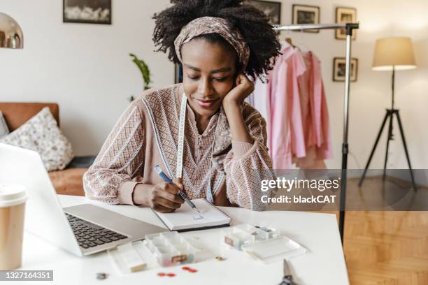 young designer at home creates new pieces of clothing for her small business - craft room stock pictures, royalty-free photos & images