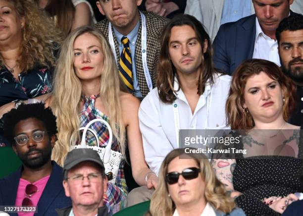 Clara Paget and Oscar Tuttiett attend day 7 of the Wimbledon Tennis Championships at the All England Lawn Tennis and Croquet Club on July 05, 2021 in...