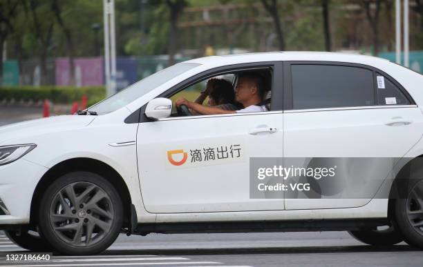 Vehicle of China's ride-hailing platform Didi Chuxing drives on the street on July 5, 2021 in Huai'an, Jiangsu Province of China.