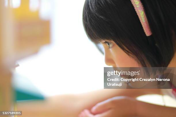 mixed race little girl in close up with make up - ボブヘア ストックフォトと画像