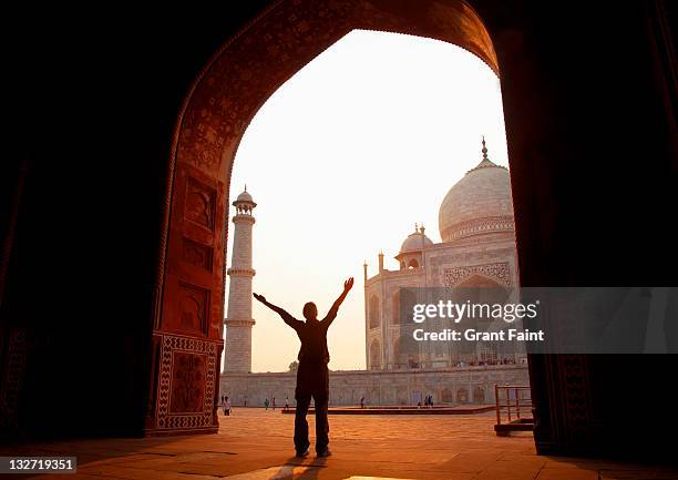 tourist enjoying taj mahal. - india tourist stock pictures, royalty-free photos & images