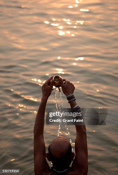 man in holy river. - ganges river stock pictures, royalty-free photos & images