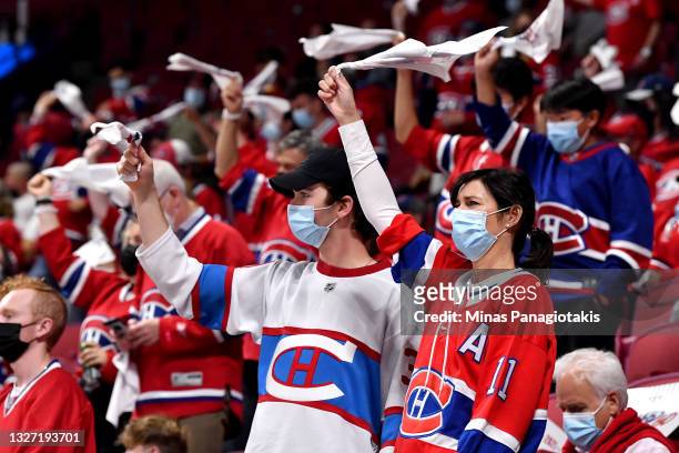 Canadiens fans cheer during the third period in Game Four of the 2021 NHL Stanley Cup Final between the Tampa Bay Lightning and the Montreal...