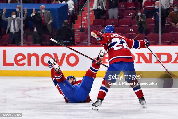 Josh Anderson of the Montreal Canadiens celebrates with Cole Caufield after scoring the game-winning goal to give his team the 3-2 win against the...