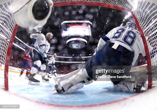 Goaltender Andrei Vasilevskiy of the Tampa Bay Lightning can't make the save on a shot for a goal by Josh Anderson of the Montreal Canadiens in the...